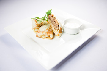 pancakes with meat and sour cream