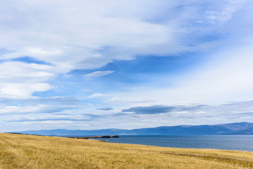 Lake Baikal and mountains of Siberia with beautiful sky and clouds, Russia Oklhon island