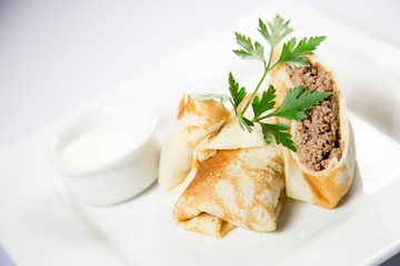 pancakes with meat and sour cream
