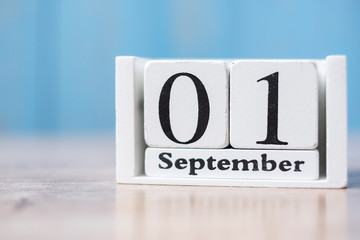 Hello September of white Calendar on wood background with copy space for text
