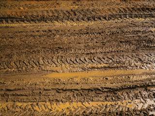Mud and slush brown. Truck tracks. Impassable