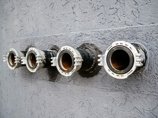 Fire extinguishing unit on the wall. Fire hydrant for connection of fire hose