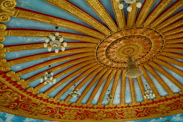 the pattern of traditional carve on ceiling of the church in temple in Thailand