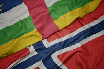 waving colorful flag of norway and national flag of central african republic.