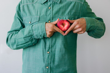 Man with heart shaped peach