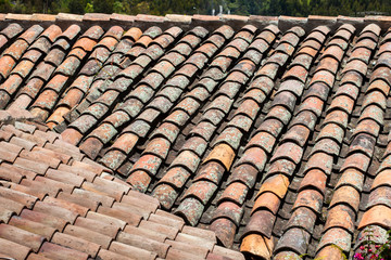 Antique clay roof tiles of the historical houses in the small town of Mongui in Colombia