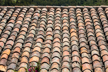 Antique clay roof tiles of the historical houses in the small town of Mongui in Colombia