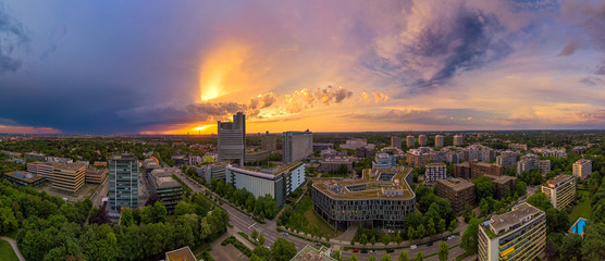 Obraz premium Munich from above, a panoramic droneshot in the colorful evening at sunset.