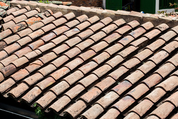 Antique clay roof tiles of the historical houses in the small town of Mongui in Colombia