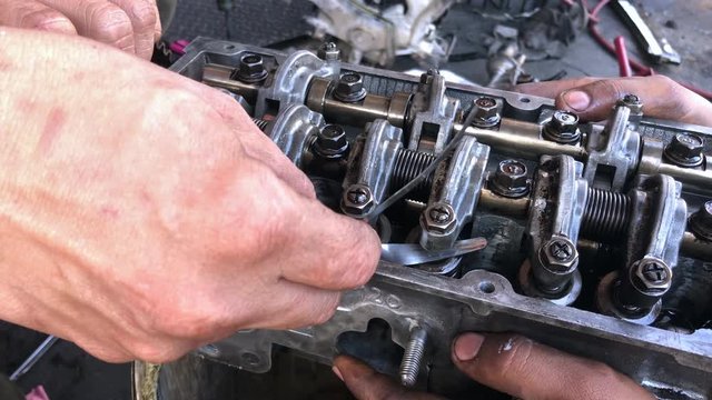 Hands on Car Engine Block petrol gasoline cylinder cam shaft spring rocker arm valve Repair refurbish