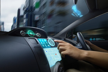 Self Driving car with futuristic graphic of GPS system driving on street in the city with Autopilot...