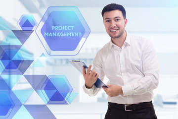 The concept of business, technology, the Internet and the network. A young entrepreneur working on...
