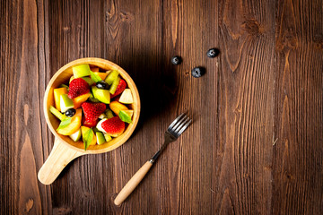 Healthy Fruits.Â  Fresh fruits salad diet slim fit for healthy lifestyle women on old wood.Â  Weight Loss and Diet Concept