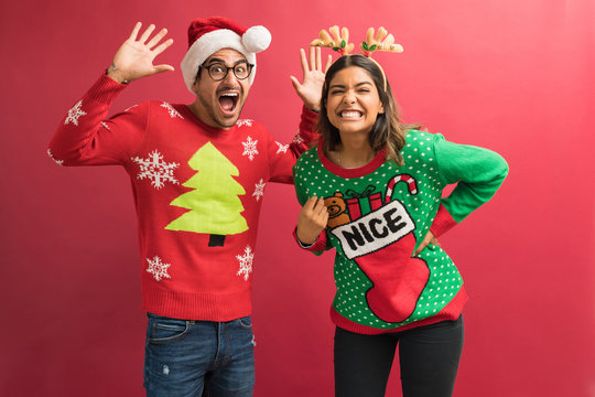 Lovely Couple In Ugly Sweaters During Christmas