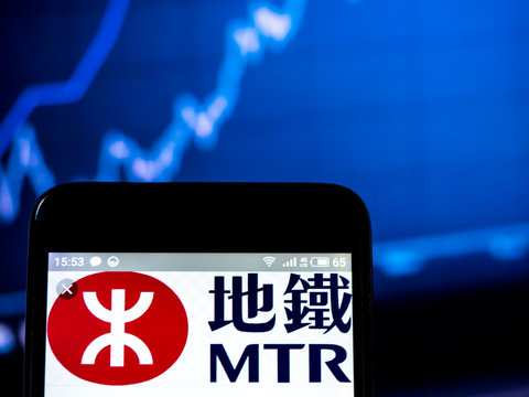  Kiev, Ukraine, March 24, 2019, Illustrative Editorial. Photo Illustration A MTR Corporation Logo Seen Displayed On A Smart Phone.