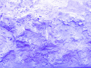 The wall of the building. Purple texture of the stone.