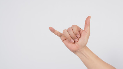 The shaka hand sign is a greeting in the hawaiian culture,subsequently aiso used in surfer culture.