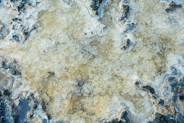 close up of high resolution texture of crystallized salt in a lake. space landscapes. Beatiful colors of nature. Travel photo background. Dried sea salt in the ground
