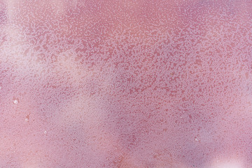 close up of high resolution texture of pink crystallized salt in a lake. space landscapes. Beatiful colors of nature. Travel photo background. Dried pink sea salt in the ground.