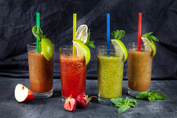 Close up viw on different set of smoothie on dark background. healthy fresh fruit and vegetable smoothies with assorted ingredients in glass. Healthy food. Detox
