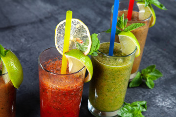 Close up viw on different set of smoothie on dark background. healthy fresh fruit and vegetable smoothies with assorted ingredients in glass. Healthy food. Detox