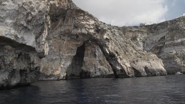 slow motion shot of the Blue Grotto caves, point of view shot from the small boat