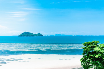 Obraz na płótnie Canvas Beautiful blue seascape with a small island on the horizon