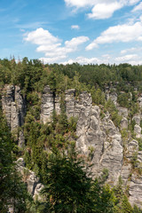 Fototapeta na wymiar Sandstone rock formations as seen from the Bastei Bridge in the Saxon Switzerland.