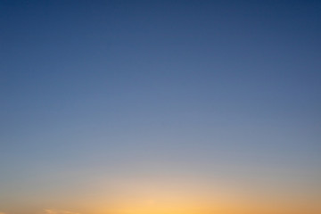 sky at sunset gradient from orange to blue
