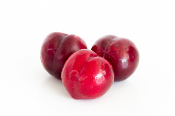 Isolated of Fresh red cherry plum on white background
