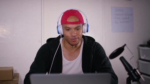 Vlogger reacting to video content he is watching online