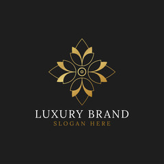 Vintage flower golden luxury logo design vector isolated on black background