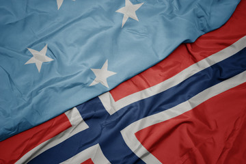 waving colorful flag of norway and national flag of Federated States of Micronesia ,.
