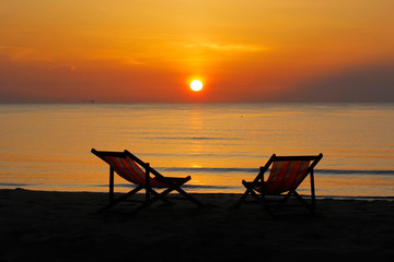 sunbed on the beach with sunrise background