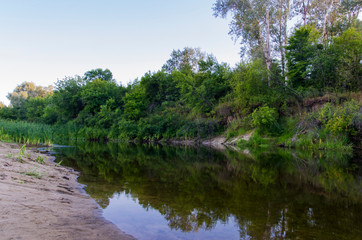 Fototapeta na wymiar Evening landscape of a small river