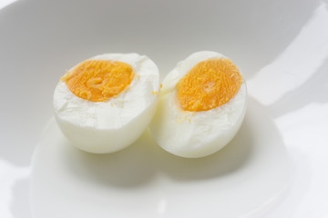 Sliced boiled eggs on white plate, Ready to eat.