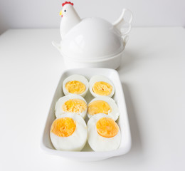 Sliced boiled eggs on white plate, Ready to eat.