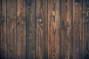 Dark brown wooden planks, texture. Grunge wood background. Rustic backdrop, pattern of natural carpentry floor. Timber wall with a knots. Rough board surface.
