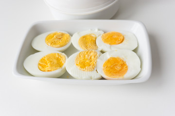 Sliced boiled eggs on white plate, Ready to eat.