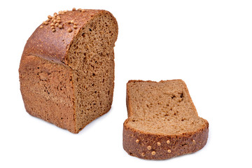 loaf of dark bread partly cut in slices, isolated on white