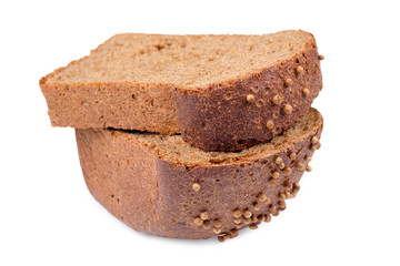 loaf of dark bread partly cut in slices, isolated on white