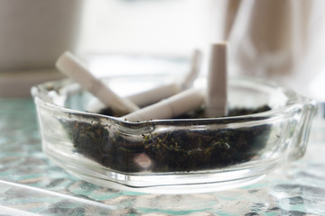 Cigarette butts in the Ashtray, Health hazards.