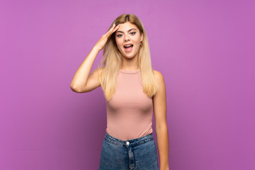 Teenager girl over isolated purple background has just realized something and has intending the solution