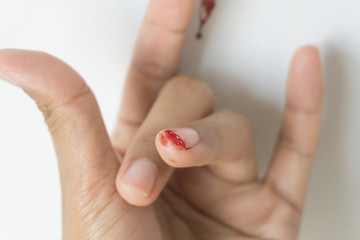 Red blood from finger, Fingers making the I Love You symbol.