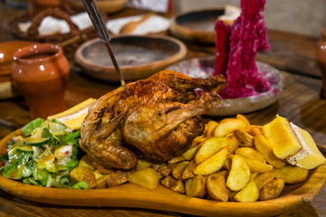 chicken meal in medieval tavern, Hungary