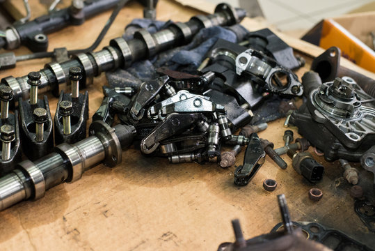 Camshaft, Bolts, Nuts, Rocker Arm Tappet Valve Taken From A Broken Car Top View