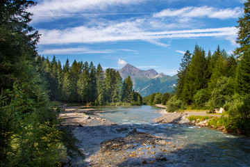 The peaks of the Alps are always spectacular with their forests and streams.