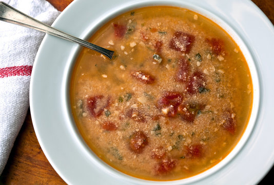 Close up of tomato straciatella soup served in bowl