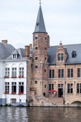 Tower building situated in one of Bruges' canals in Belgium