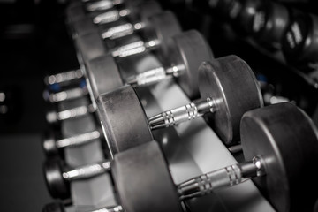 Fototapeta premium row of dumbbell in fitness gym